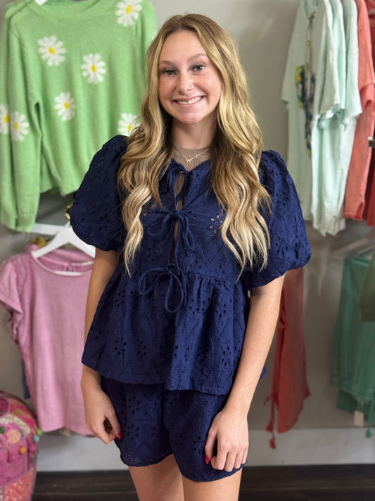 Navy 2-pc Short Set w/Waisted Elastic Shorts and Puff Sleeve Bow Front Eyelet Tie Top.
